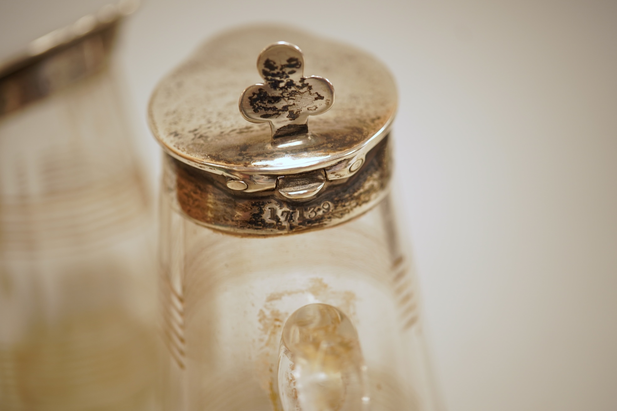 A pierced 800 standard white metal fruit bowl, diameter 23.6cm, a silver mounted hand mirror and two brushes, a 19th century continental white metal pyx, a pair of George V silver mounted whisky noggins, Birmingham, 1925